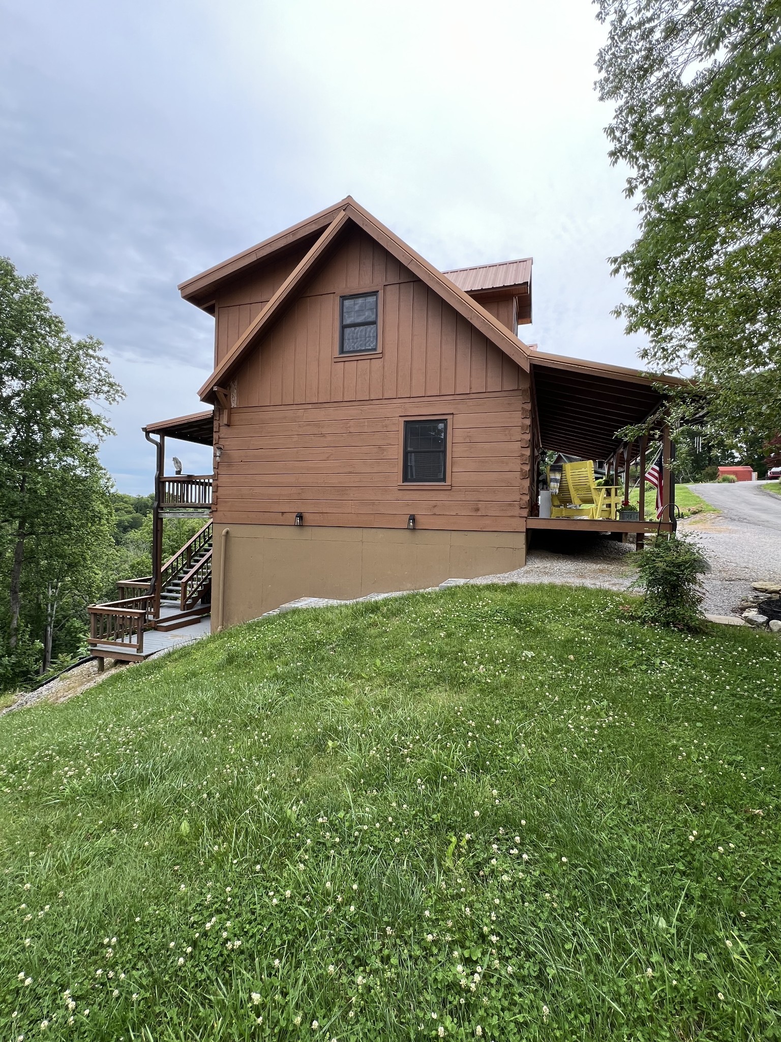 225 Bill Hunter Road Celina, TN 38551 - Photo 10 of 57 a view of a house with a yard and sitting area