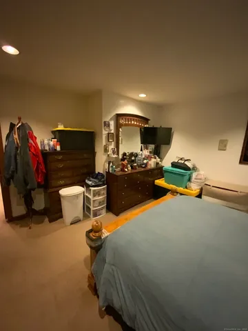 a bedroom with furniture and a fireplace