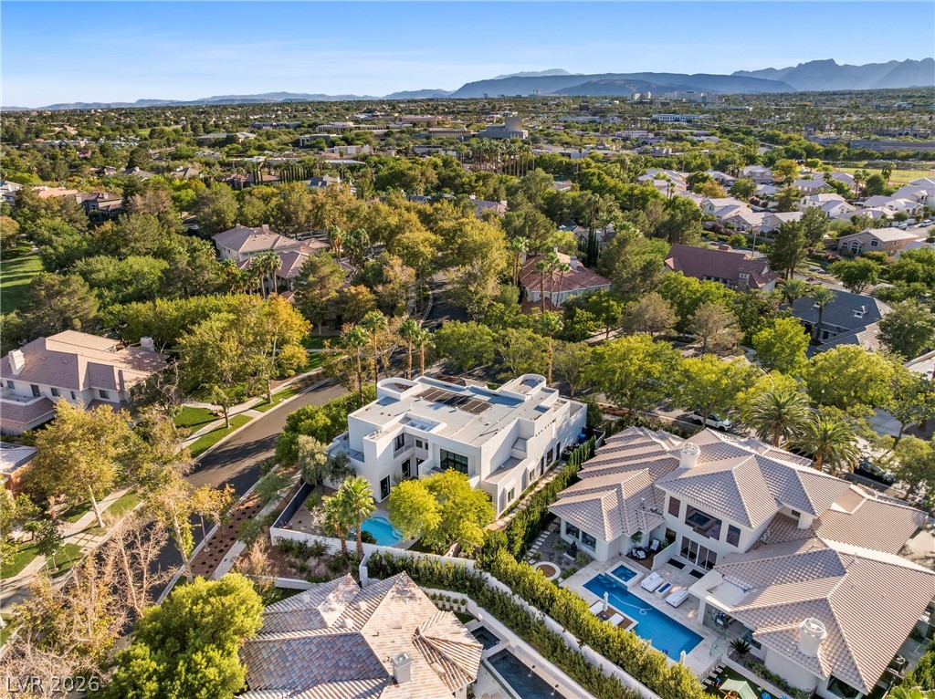 2000 Grouse Street Las Vegas, NV 89134 - Photo 88 of 89 An aerial perspective reveals the expansive layout of this contemporary estate, featuring multiple pools and verdant landscaping.