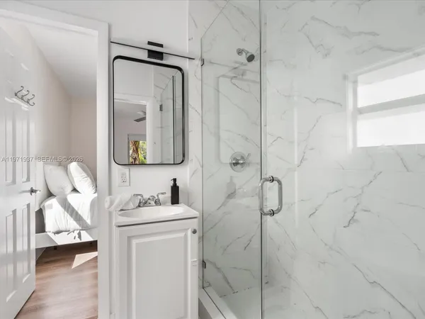 a en suite bathroom with a toilet sink and mirror