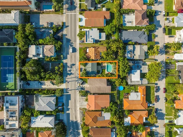 an aerial view of residential houses with outdoor space
