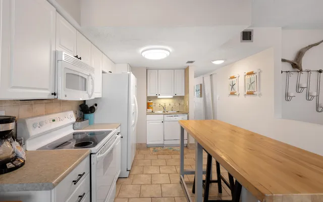 a bedroom with a bed and a mirror