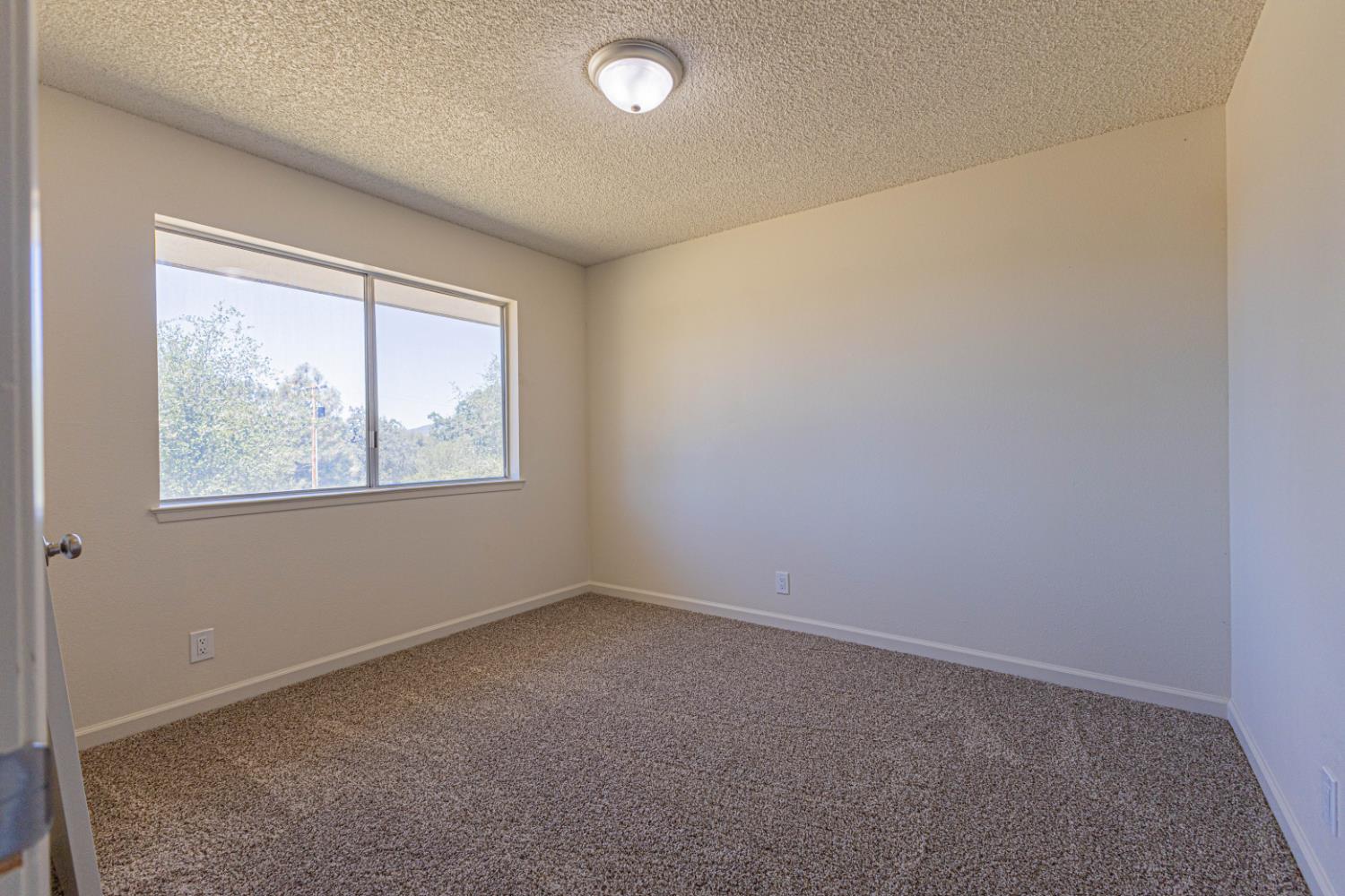 31612 Duke Road North Fork, CA 93643 - Photo 15 of 44 an empty room with windows