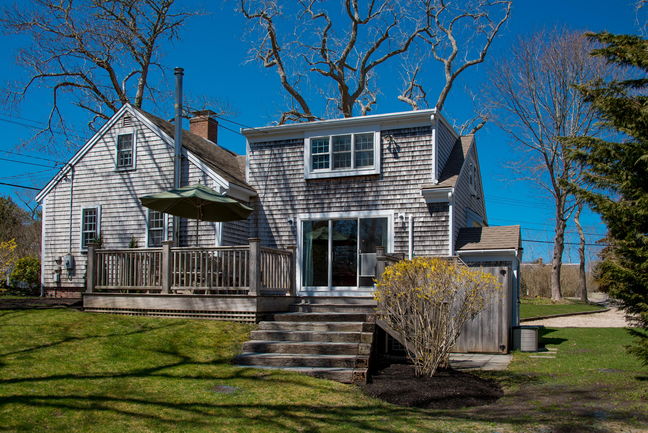 20 Salt Pond Road Eastham, MA 02642 - Photo 7 of 34 a front view of a house with a yard