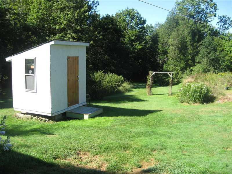 705 Dutch Neck Road Waldoboro, ME 04572 - Photo 7 of 31 Exterior Back. Backyard with storage...
