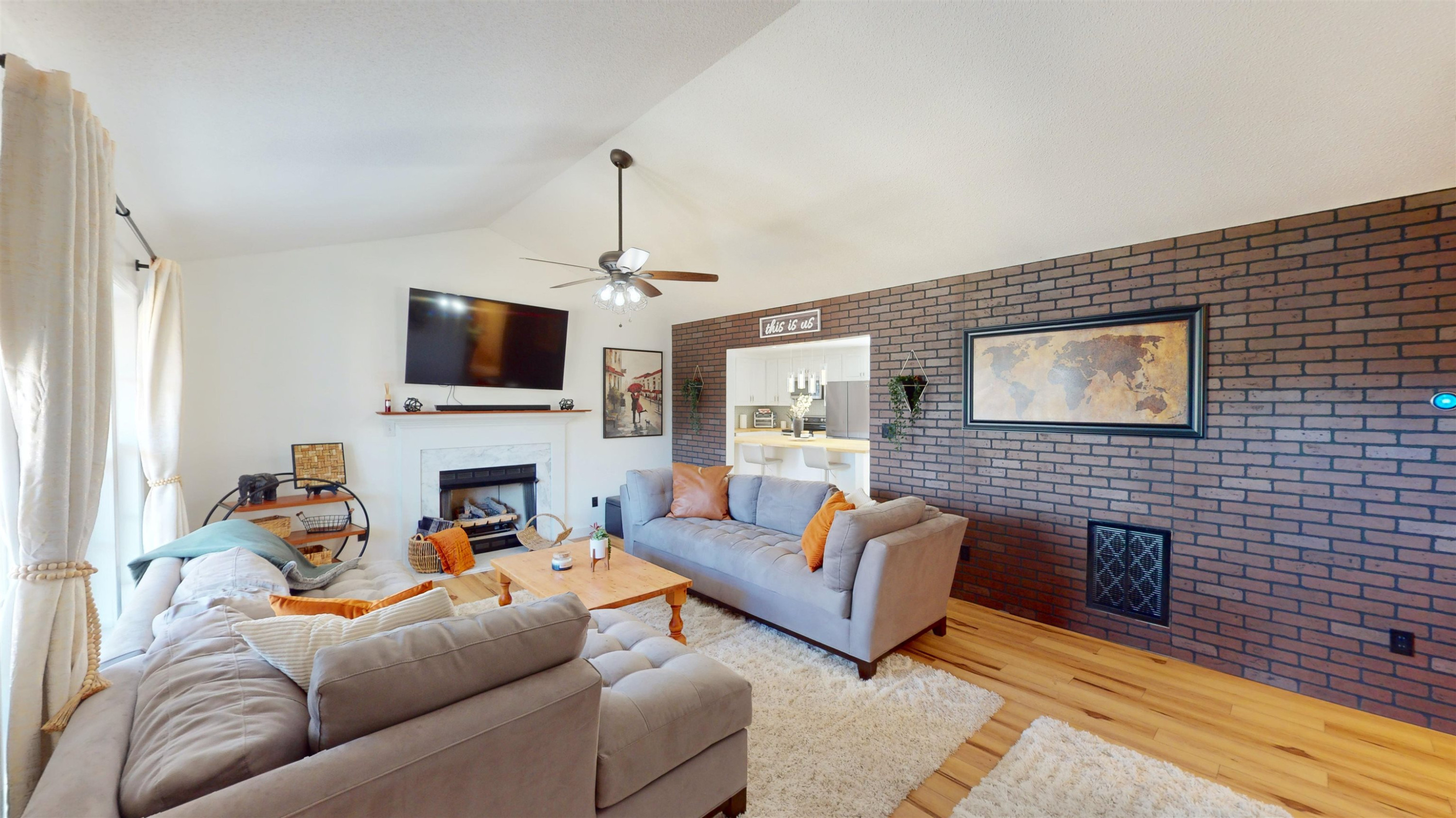 1036 Drew Drive Garner, NC 27529 - Photo 28 of 59 a living room with furniture a fireplace and a flat screen tv