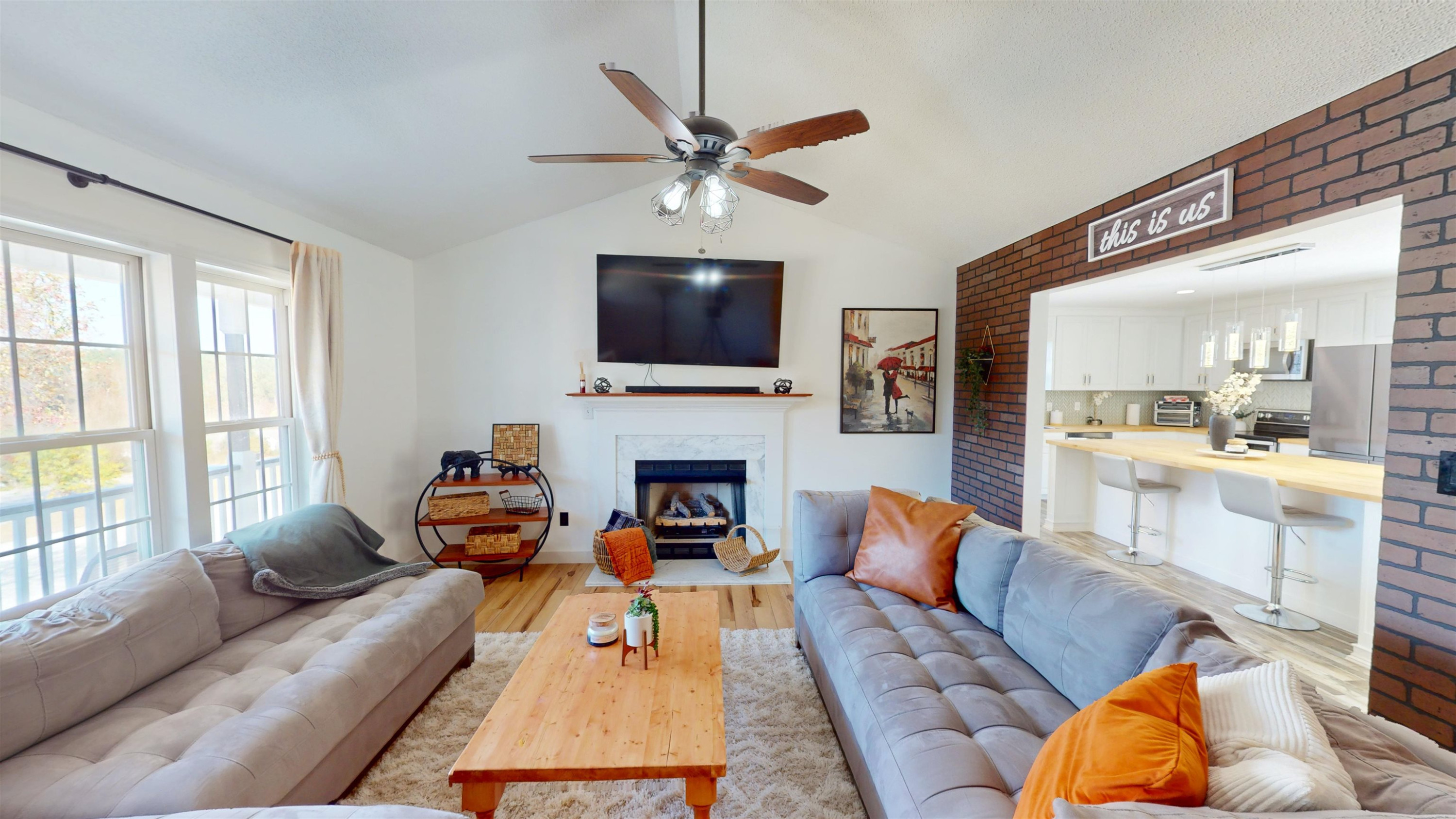 1036 Drew Drive Garner, NC 27529 - Photo 29 of 59 a living room with furniture a fireplace and a flat screen tv