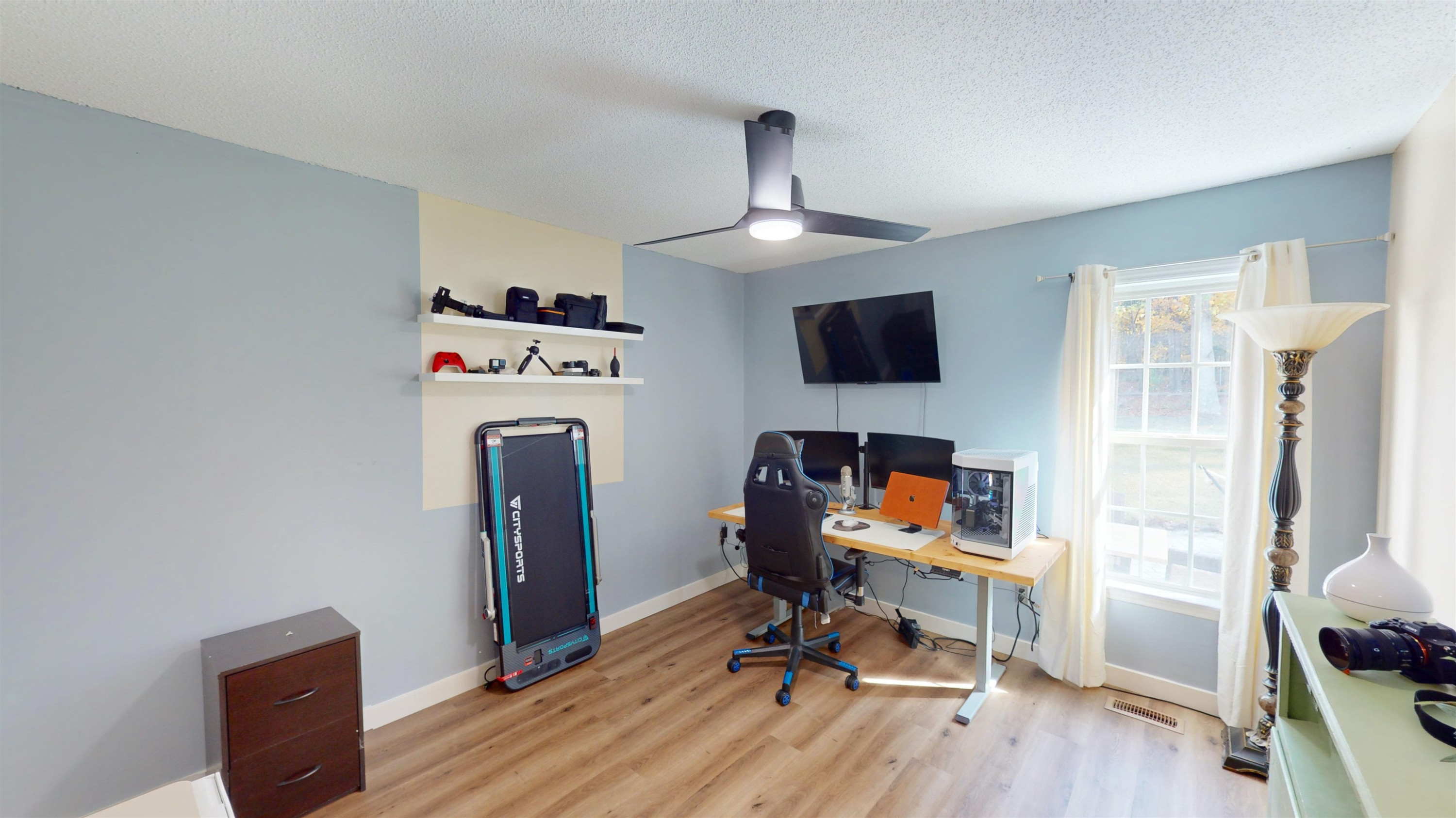 1036 Drew Drive Garner, NC 27529 - Photo 32 of 59 a view of a workspace with furniture and a window