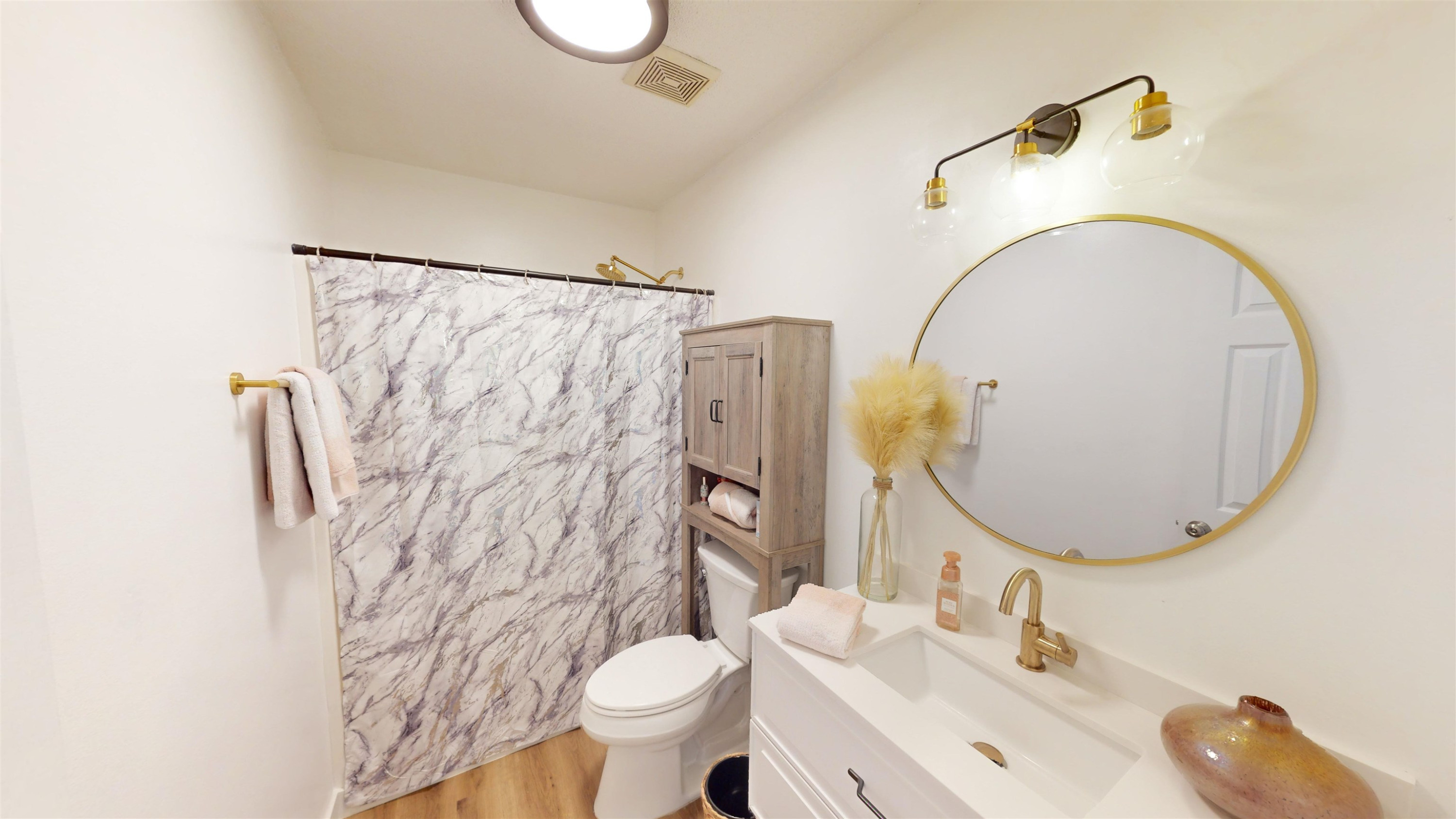 1036 Drew Drive Garner, NC 27529 - Photo 36 of 59 a bathroom with a sink mirror toilet and shower