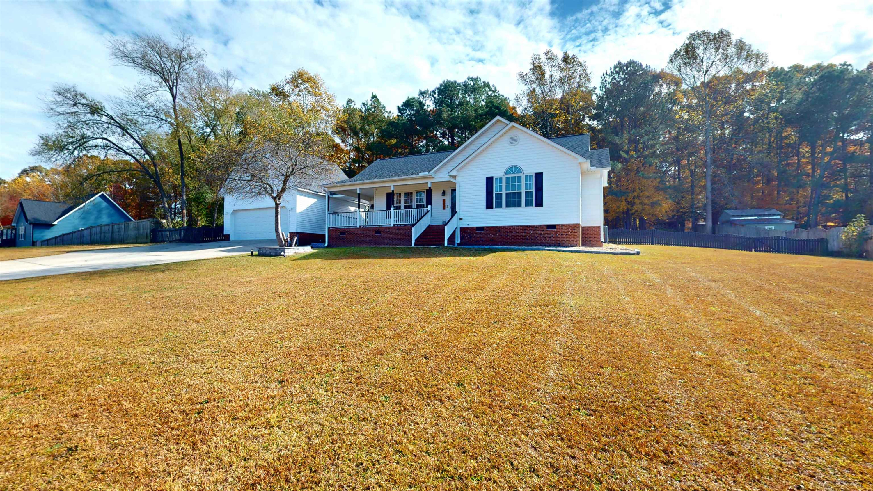 1036 Drew Drive Garner, NC 27529 - Photo 4 of 59 a view of house with yard and swimming pool