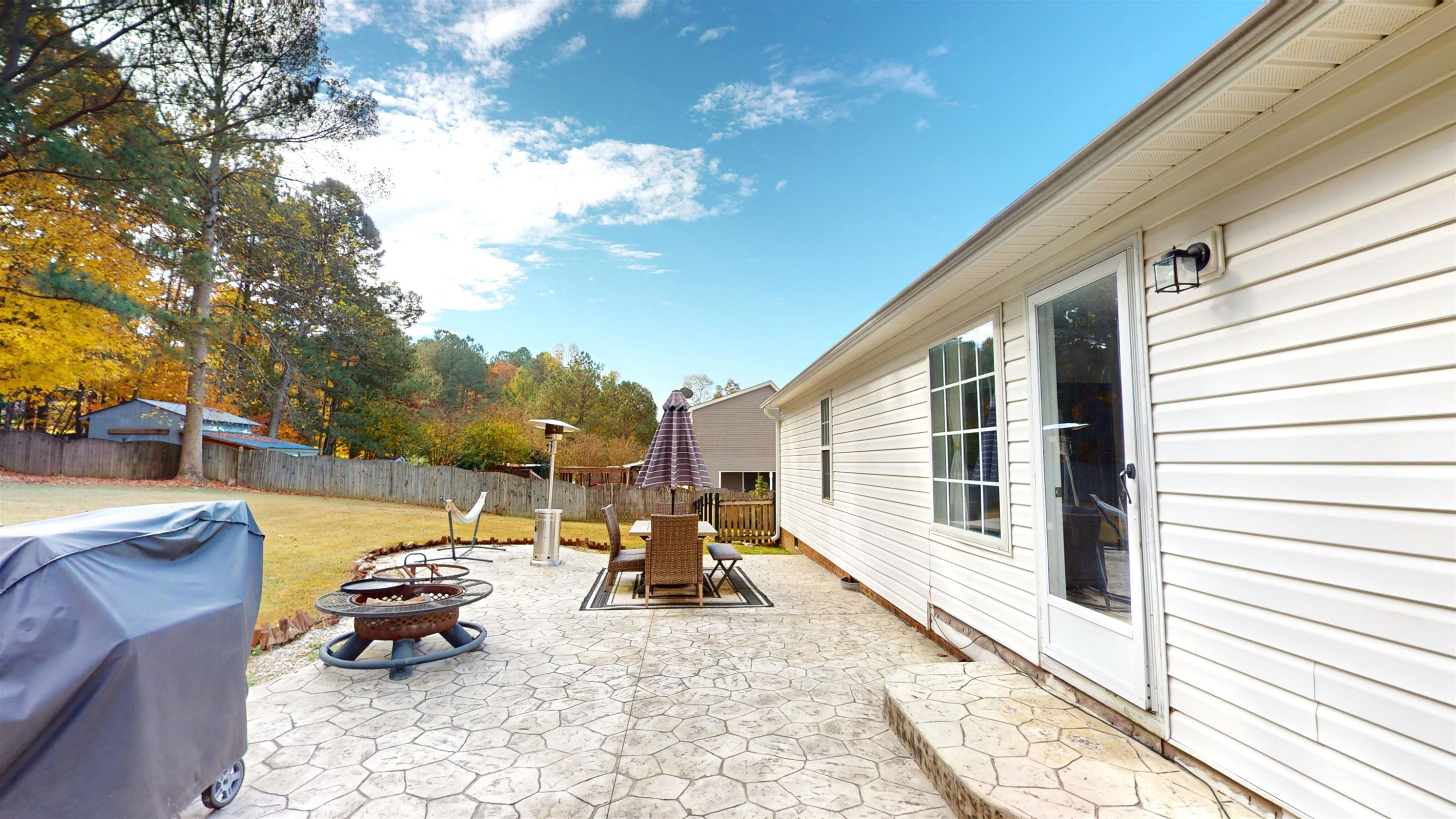 1036 Drew Drive Garner, NC 27529 - Photo 49 of 59 a backyard of a house with outdoor seating