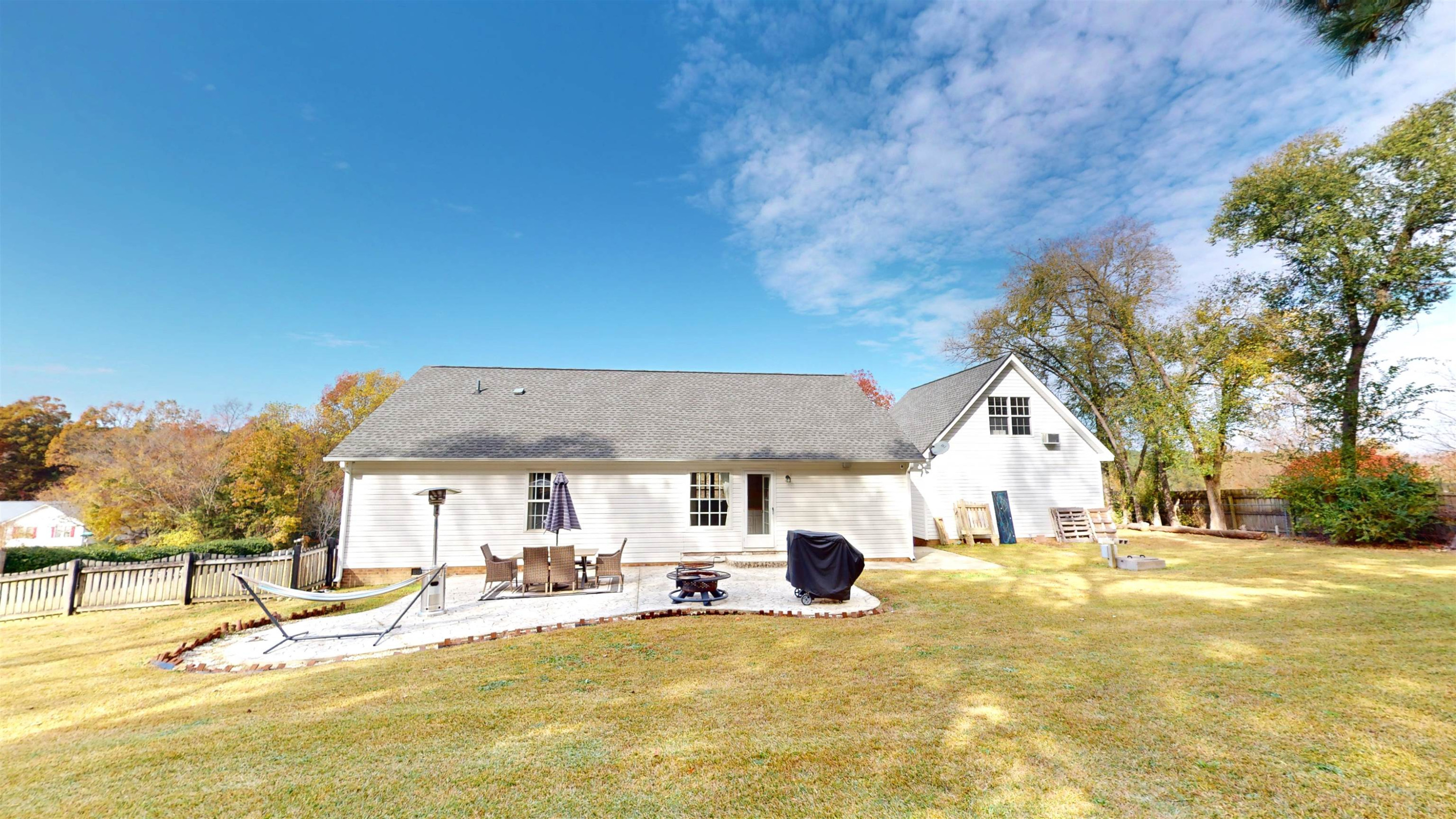 1036 Drew Drive Garner, NC 27529 - Photo 50 of 59 a view of white house with swimming pool and sitting area