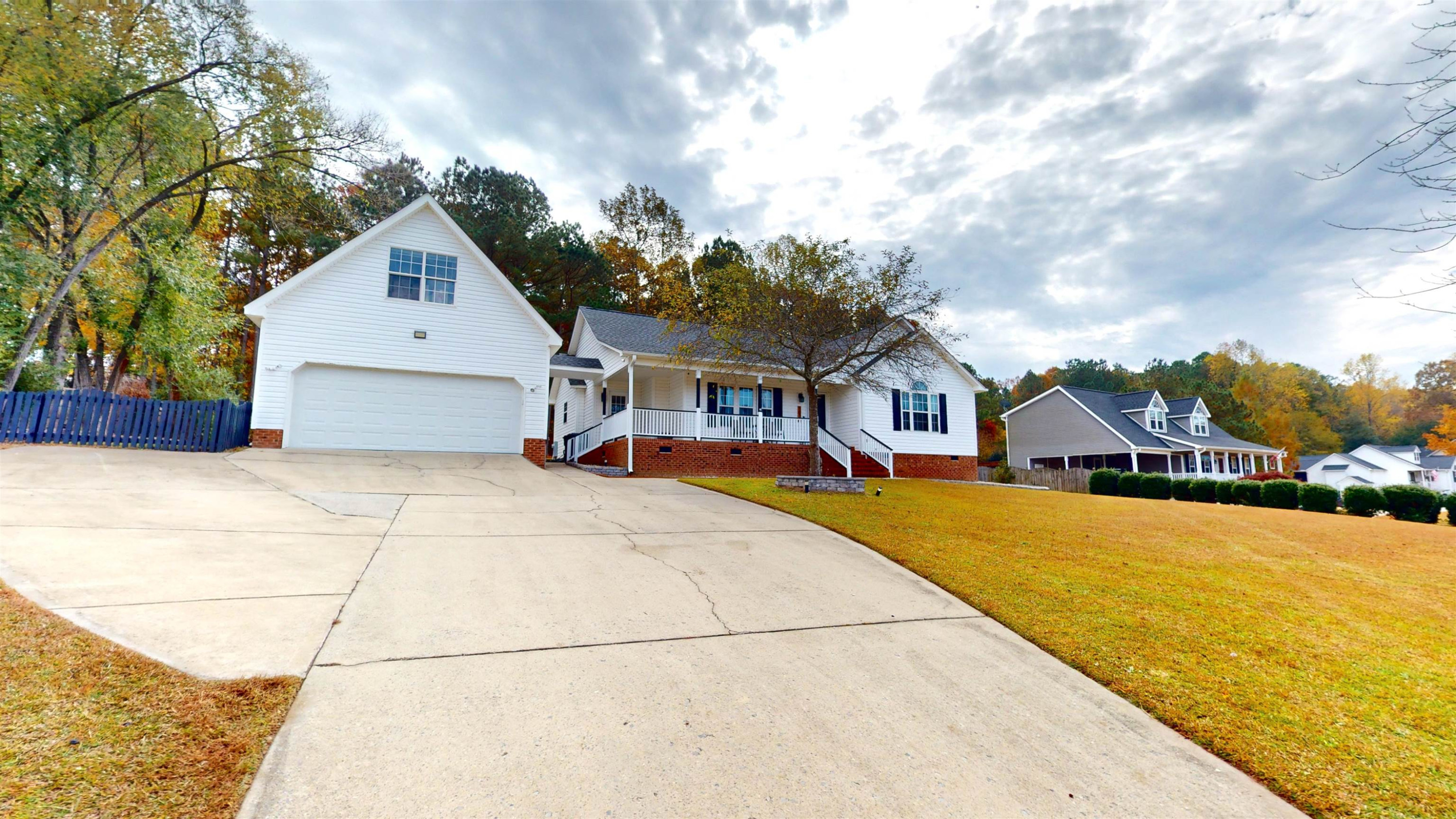 1036 Drew Drive Garner, NC 27529 - Photo 5 of 59 a front view of a house with a yard
