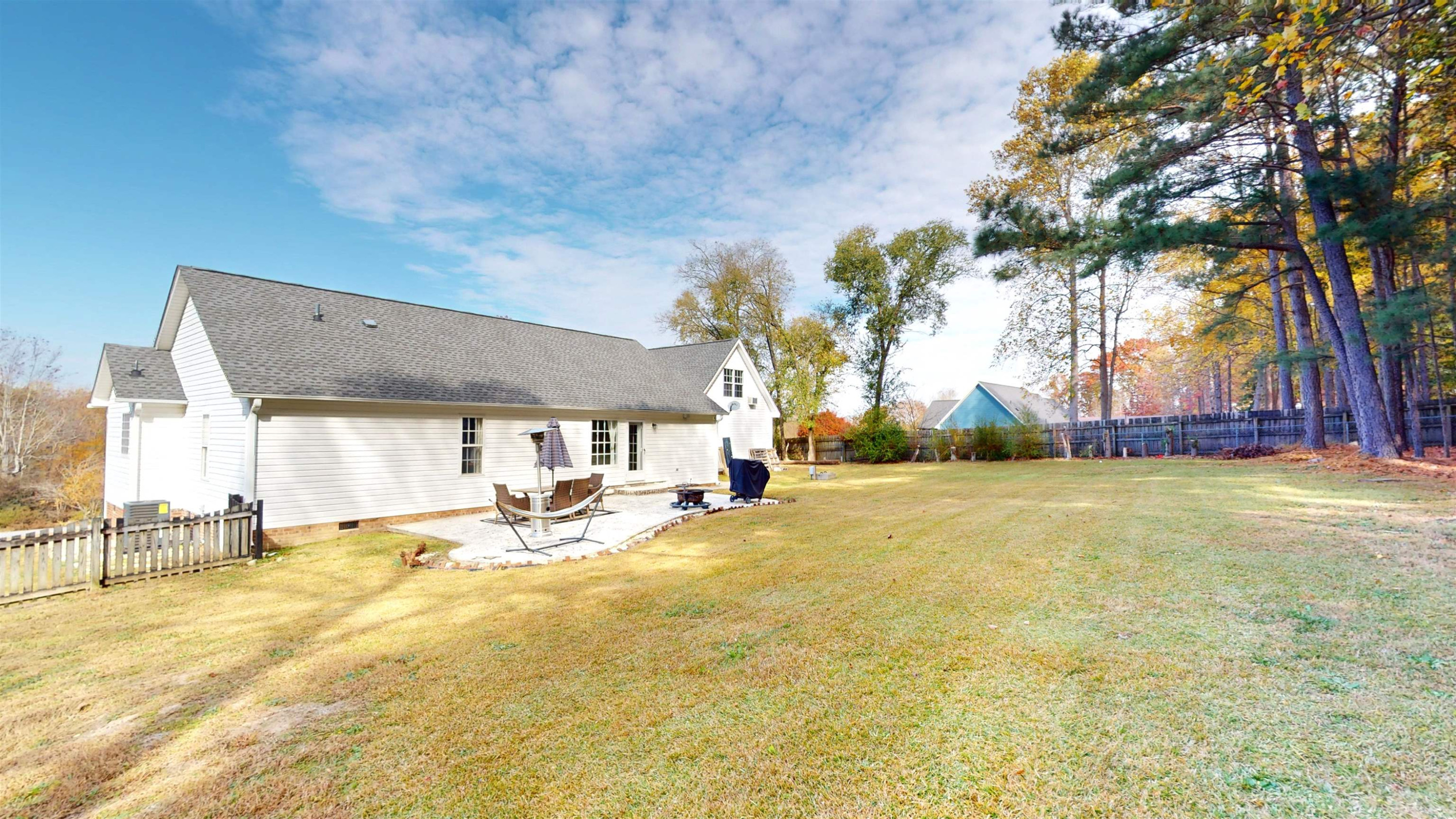 1036 Drew Drive Garner, NC 27529 - Photo 51 of 59 a view of a swimming pool with an outdoor seating and a yard
