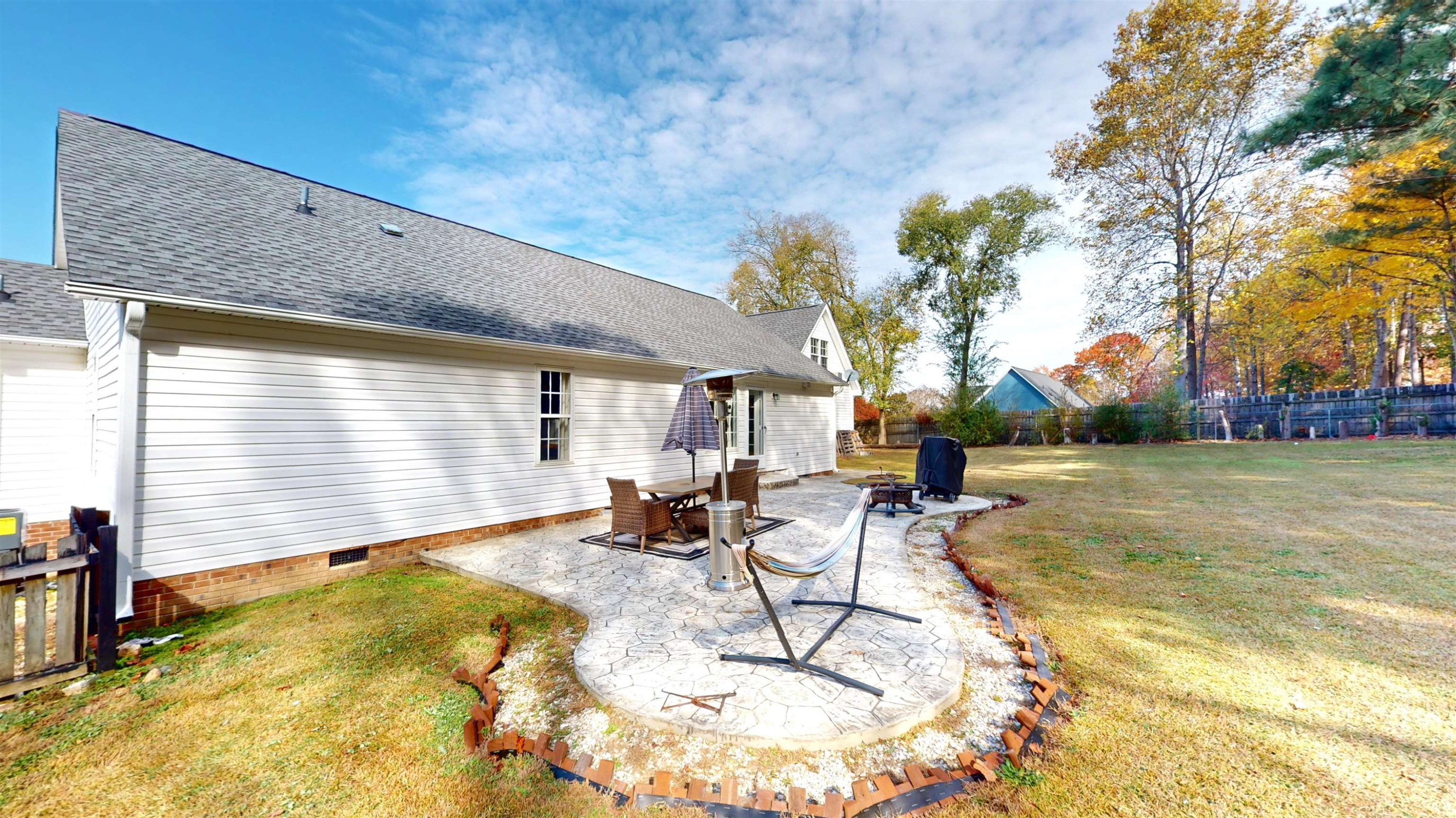 1036 Drew Drive Garner, NC 27529 - Photo 52 of 59 a swimming pool with outdoor seating and yard