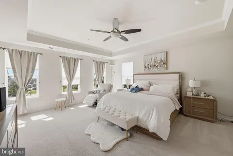 a spacious bedroom with a bed and window