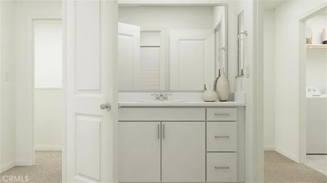 a bathroom with a toilet sink and shower
