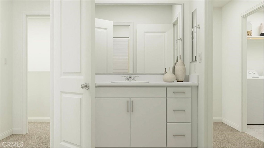 1674 Phantom Lane Rialto, CA 92376 - Photo 7 of 18 a bathroom with a sink and a mirror