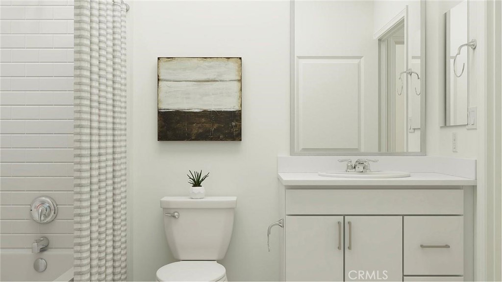 1674 Phantom Lane Rialto, CA 92376 - Photo 10 of 18 a bathroom with a sink a toilet and mirror