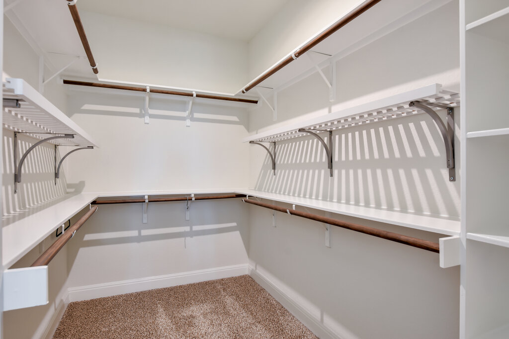 2521 Blended Tree Ranch Drive Leander, TX 78641 - Photo 28 of 40 a view of a room with racks on the wall