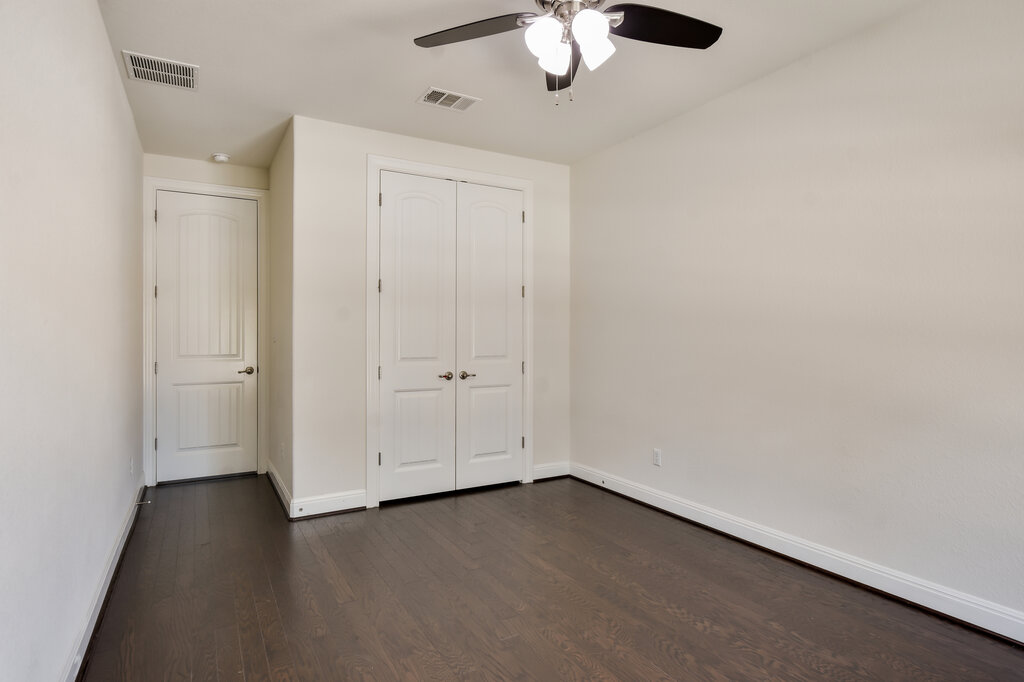 2521 Blended Tree Ranch Drive Leander, TX 78641 - Photo 30 of 40 an empty room with a chandelier fan