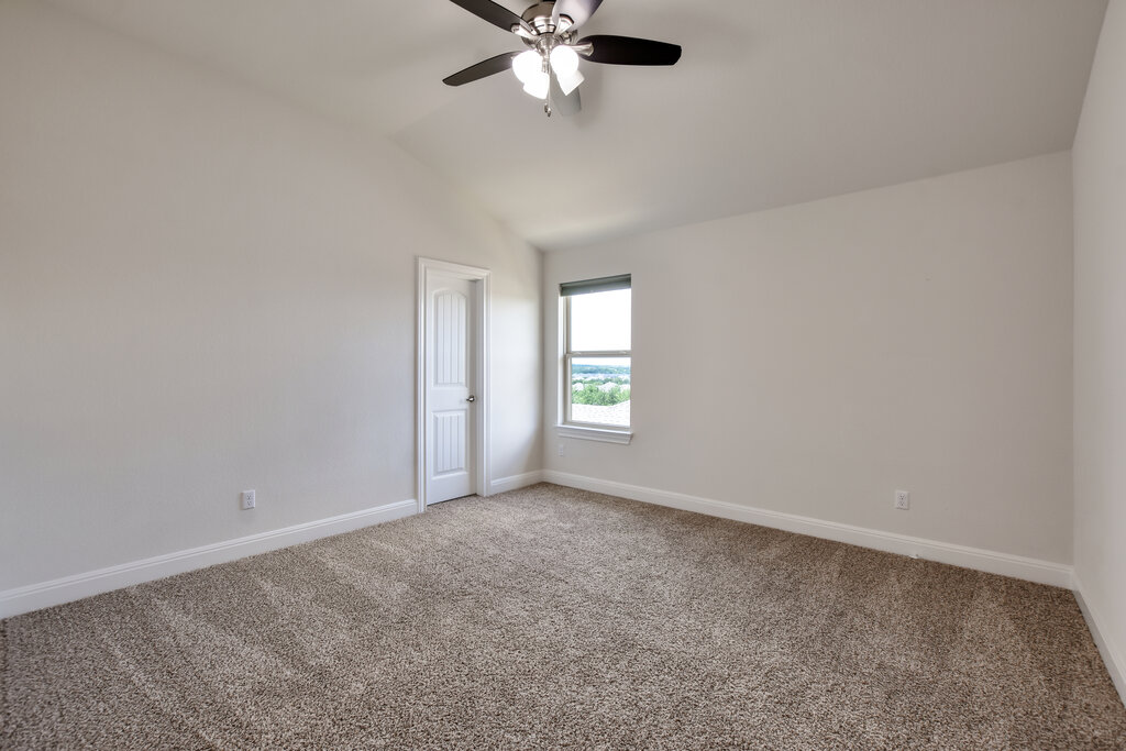 2521 Blended Tree Ranch Drive Leander, TX 78641 - Photo 34 of 40 an empty room with windows and fan