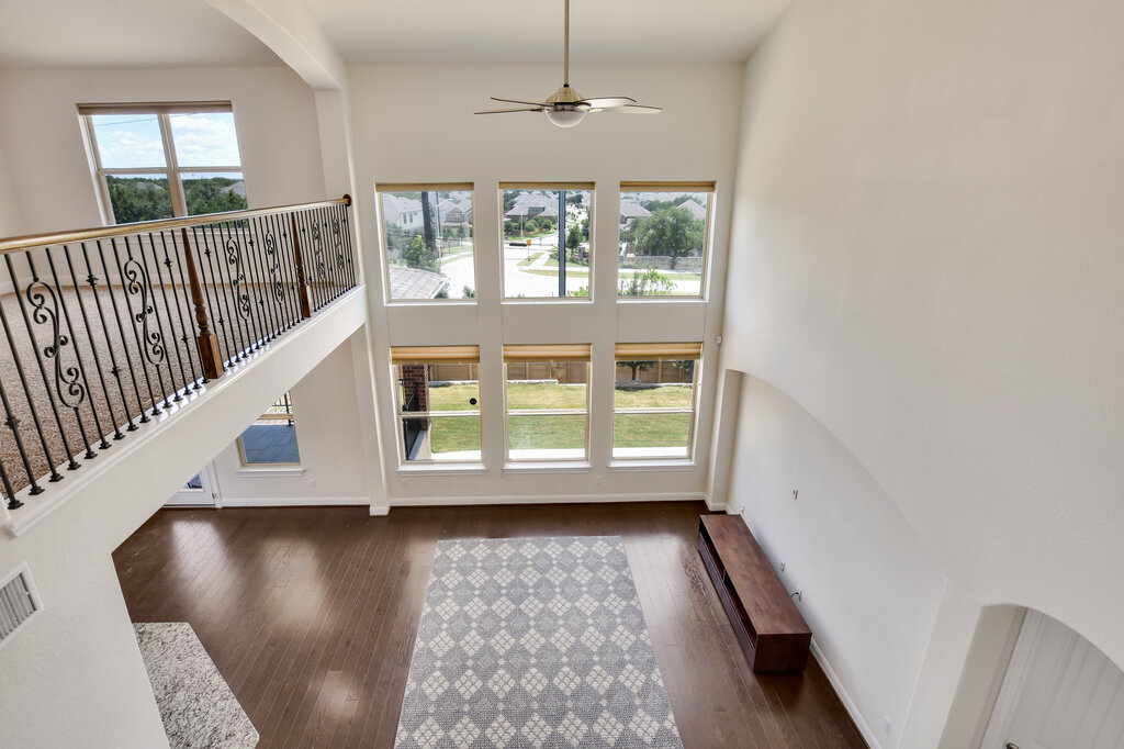 2521 Blended Tree Ranch Drive Leander, TX 78641 - Photo 36 of 40 wooden floor in an empty room with a window