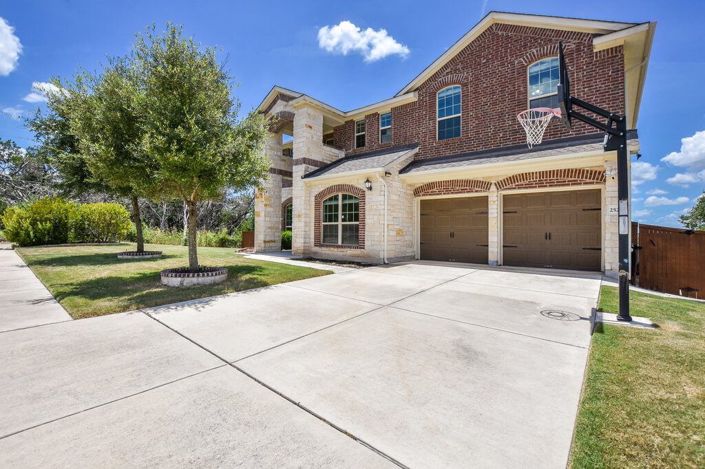 2521 Blended Tree Ranch Drive Leander, TX 78641 - Photo 4 of 40 a house view with a outdoor space