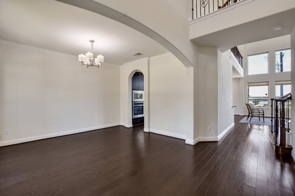 2521 Blended Tree Ranch Drive Leander, TX 78641 - Photo 8 of 40 wooden floor in an empty room with a window