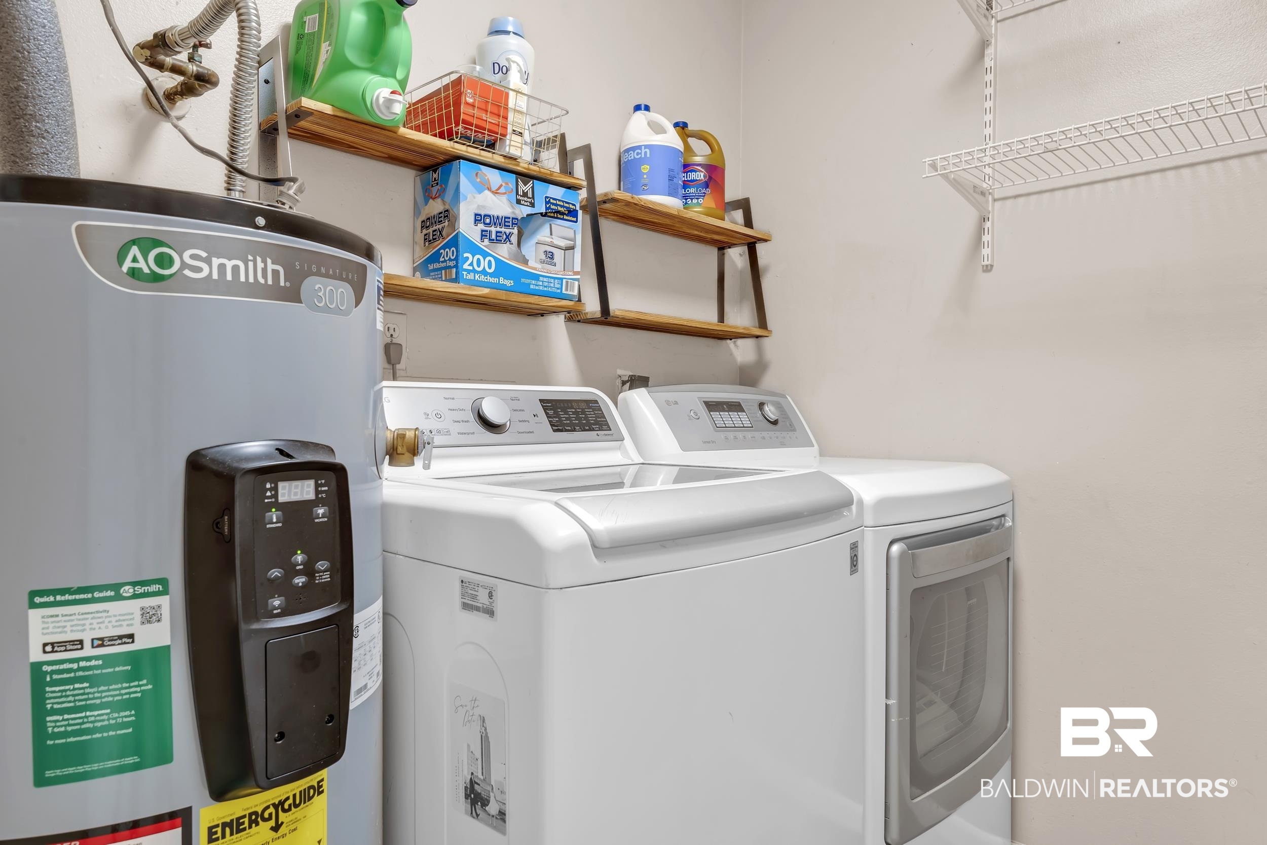 9660 Howells Ferry Road Semmes, AL 36575 - Photo 23 of 23 Washroom with electric water heater and washer and dryer