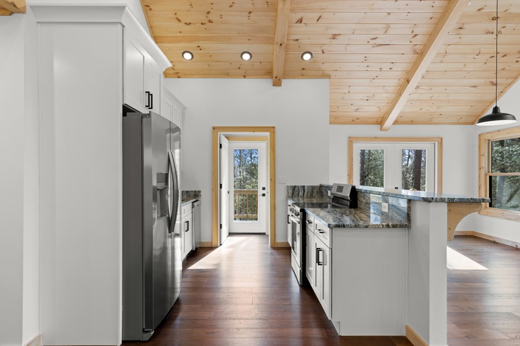 150 Williams Branch Drive Morganton, GA 30560 - Photo 12 of 28 a kitchen with stainless steel appliances granite countertop a refrigerator and a stove