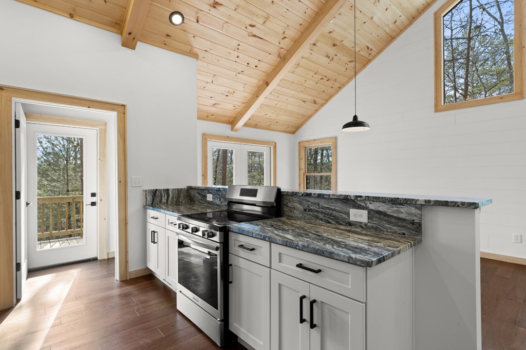 150 Williams Branch Drive Morganton, GA 30560 - Photo 16 of 28 a kitchen with stainless steel appliances granite countertop a stove and cabinets