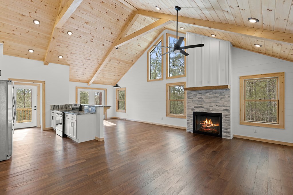 150 Williams Branch Drive Morganton, GA 30560 - Photo 10 of 28 a view of a livingroom with fireplace wooden floor and windows