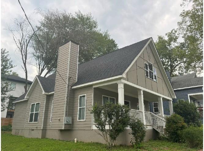 1005 Linam Avenue Southeast Atlanta, GA 30315 - Photo 4 of 29 a view of a white house next to a yard