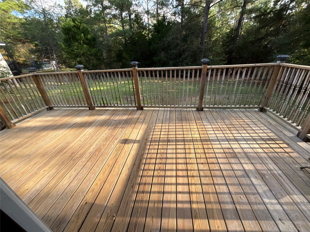 239 Old Firetower Road Bastrop, TX 78602 - Photo 20 of 39 a view of balcony with wooden floor