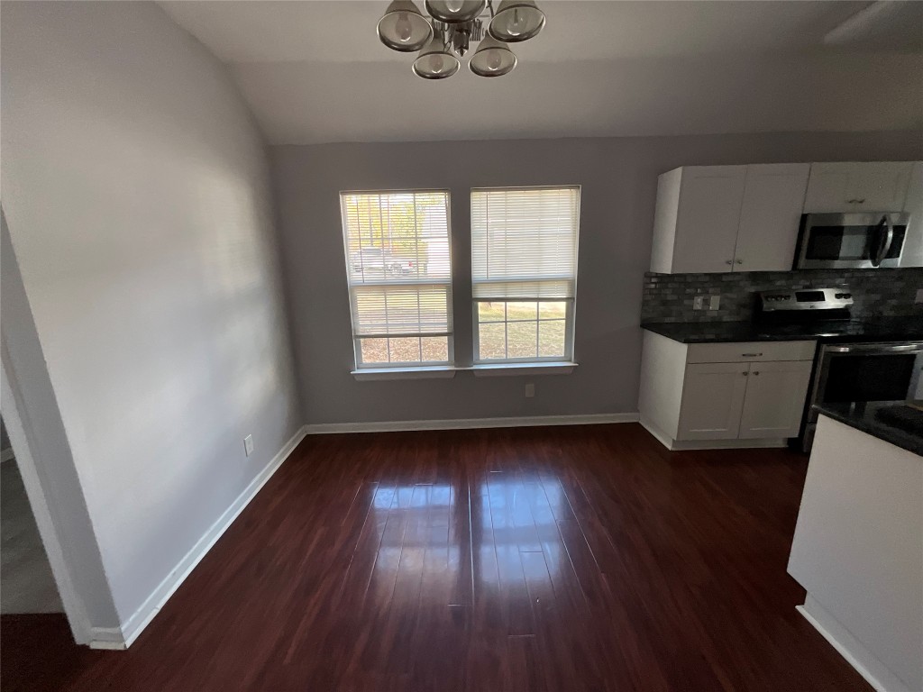 239 Old Firetower Road Bastrop, TX 78602 - Photo 25 of 39 wooden floor in an empty room with a window