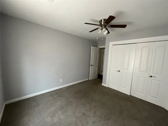 a view of a chandelier fan in a room