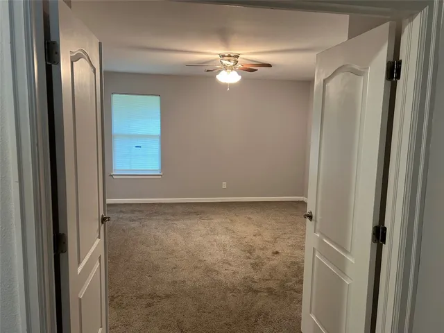 a kitchen with stainless steel appliances granite countertop a sink cabinets and wooden floor