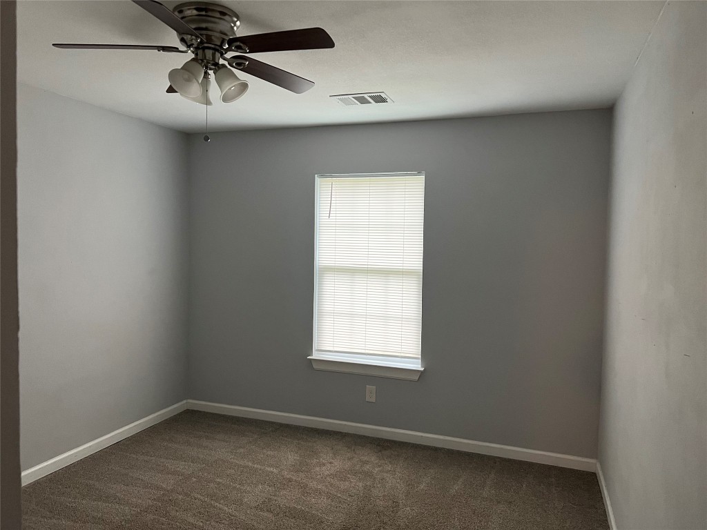239 Old Firetower Road Bastrop, TX 78602 - Photo 5 of 39 an empty room with a window