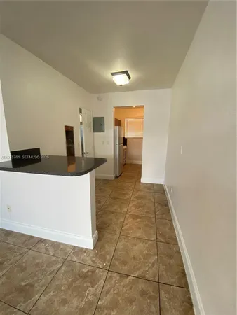 a view of a storage & utility room with a sink