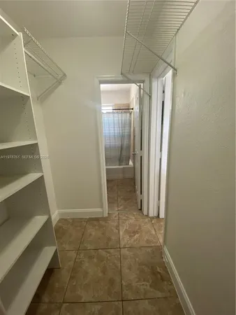 a bathroom with a toilet a sink and bathtub