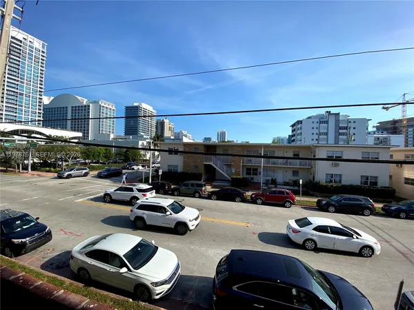a view of a car parked in front of a building