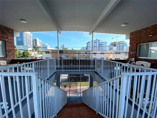 a view of a house with pool and deck