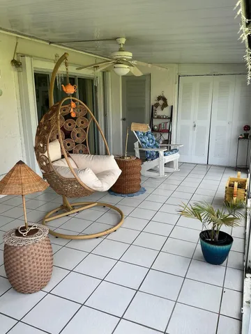 a living room with furniture and chairs