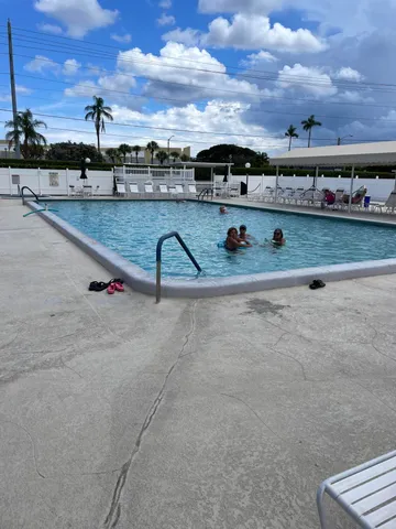 a view of a swimming pool with a terrace