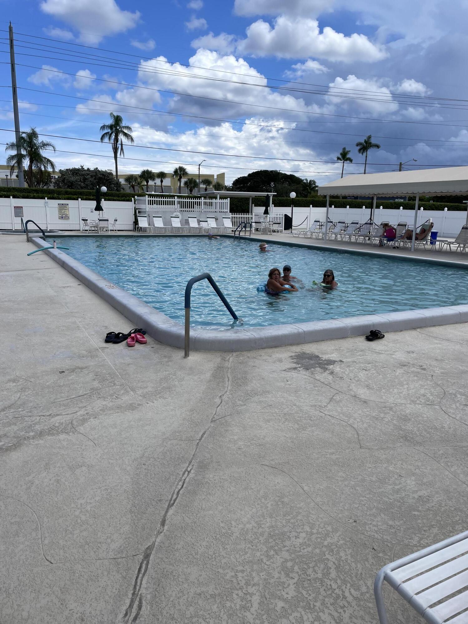 1580 Northwest 18th Avenue, Unit 98B Delray Beach, FL 33445 - Photo 16 of 16 a view of a swimming pool with a terrace