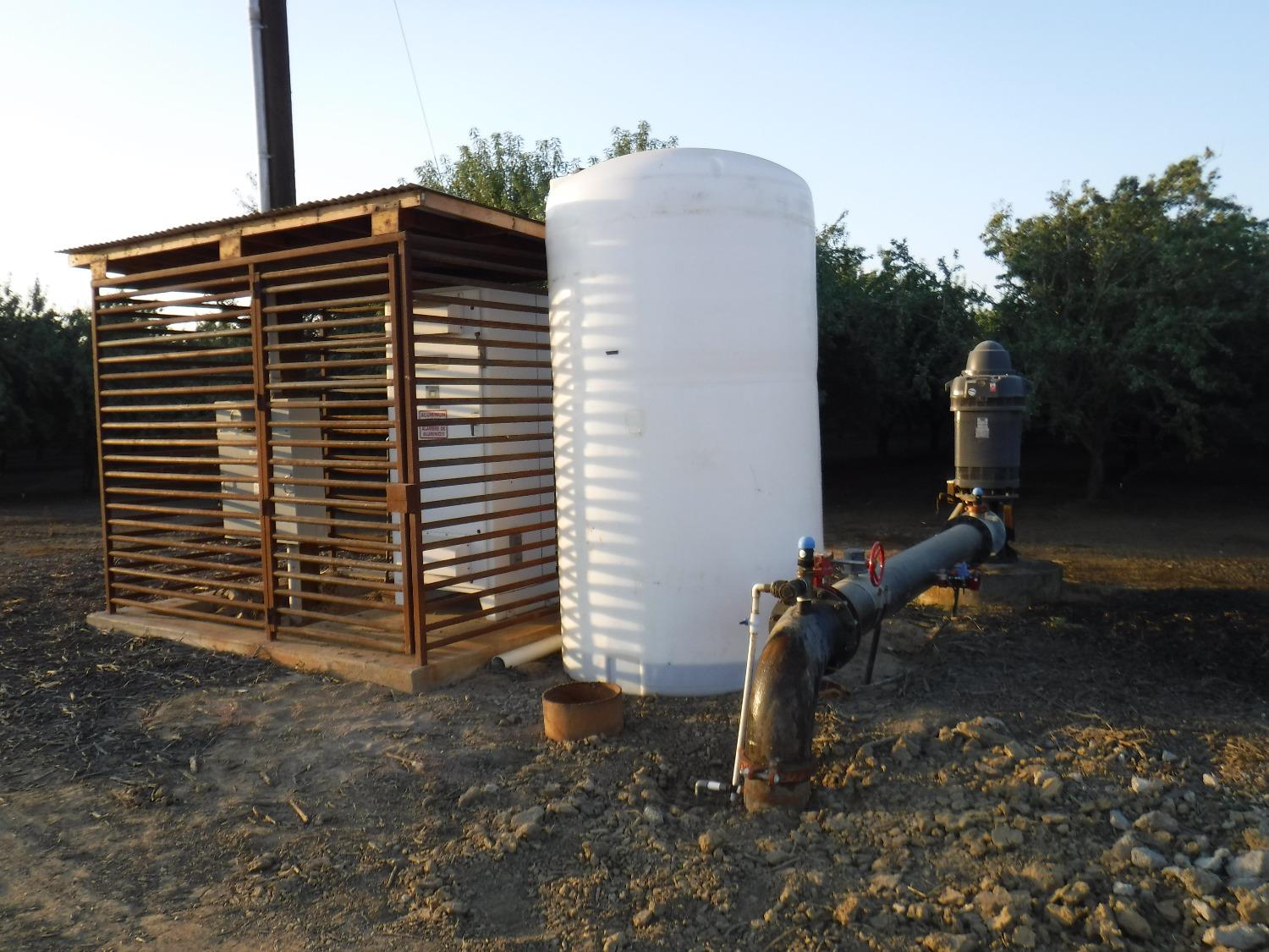 18401 Davis Road Patterson, CA 95363 - Photo 11 of 20 a view of a house with a backyard