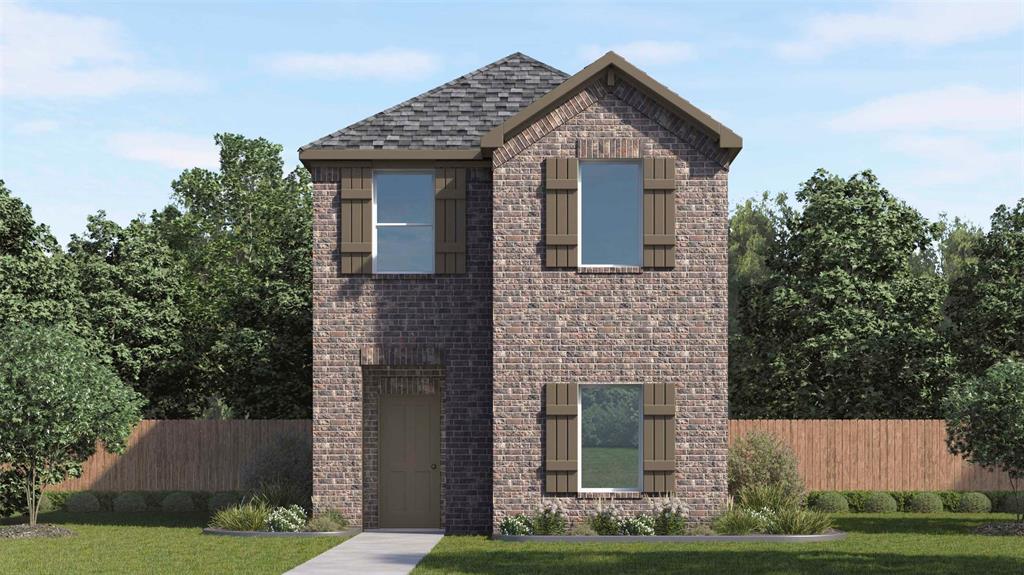 Two-story residence featuring a brick facade with a gabled roofline