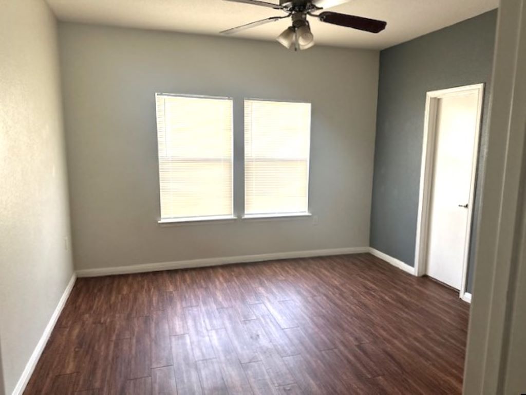 4704 Ledesma Road, Unit A & B Austin, TX 78721 - Photo 18 of 24 an empty room with a window and a fan