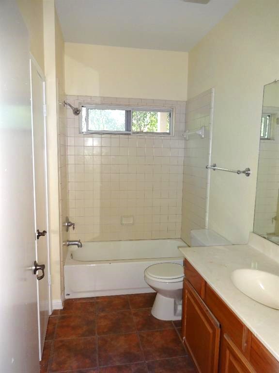4704 Ledesma Road, Unit A & B Austin, TX 78721 - Photo 20 of 24 a bathroom with a sink a toilet and shower